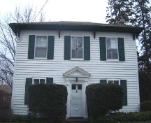 West facing façade featuring pediment with fluted half columns and tympanum, 2007.; Lindsay Benjamin, 2007.