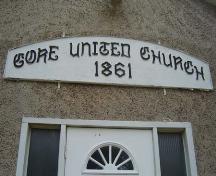 Featured is the sign above the front entrance that commemorates the date of construction.; Martina Braunstein, 2007.