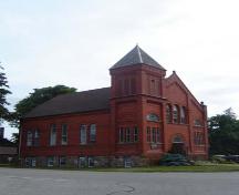 Of note is the three-storey bell tower and steep cone-shaped roof.; Martina Braunstein, 2007.