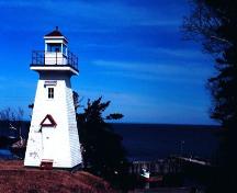 Front elevation of Hampton Lighthouse and view of Chute Bay, NS, 2002.; Hampton Lighthouse and Historical Society March 2002