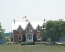Of note are the bargeboard and finials on the three front gables.; Kendra Green, 2007.
