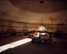 View of the interior of a kiln, showing the in-situ equipment dating from the 1912-1937 period, 1995.; Agence Parcs Canada / Parks Canada Agency, HRS 1035, 1995.