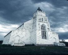General view of Holy Trinity Church National Historic Site of Canada, showing its steeply-pitched gable roof and tall, spired tower.; Parks Canada / Parcs Canada.