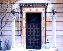 Detail view of the Masonic Memorial Temple, showing the main entrance with its bronze door and surrounding motifs, 2000.; Parks Canada Agency / Agence Parcs Canada, A. Waldron, 2000.