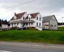 The building constructed in 1895 is in the foreground. The building constructed in 1865 is in the background. There is also a sign that says "Complexe Maxime Albert".; Madawaska Planning Commission