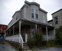 This image shows a corner view of the house taken from Duke Street; City of Saint John