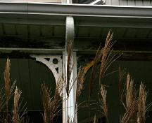 This image shows the ornamental brackets under the veranda roofline; City of Saint John