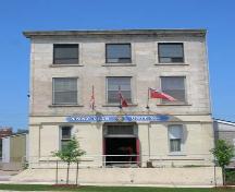 Of note are the four stone pillars and central recessed entrance on the first-storey.; Lyndsay Haggerty, 2007.