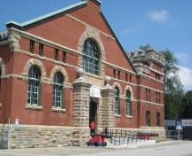 Image taken from parking lot, north facade with crenulated turret and rounded openings; Sarah Middleton, Brock University, 2008