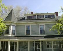 This photograph shows the bay window with semi-octagonal roof and multi-paned dormer window, 2008; Town of St. Andrews