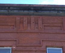 This photograph illustrates the corbel bands of the cornice, 2009; Town of St. Andrews