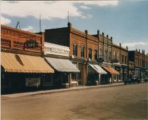 Archival view, from the northwest, of the McCullough Building (left, with white cornice), Carberry, ca. 1945; Carberry Plains Archives, ca. 1945