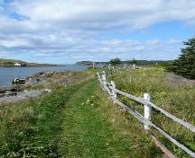Path leading to St. Matthew's United Church Southside Cemetery, New Perlican, NL. Photo taken 2009. ; HFNL/Andrea O'Brien 2009