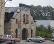 Of note are the parapet and unusually-shaped gable roof.; Kayla Jonas, 2007.