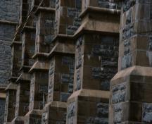 Exterior detail of the stone buttresses on the south facade of the Anglican Cathedral of St. John the Baptist, 016 Church Hill, St. John's, NL.; HFNL 2006