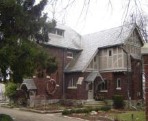 Featured is the wood boarding, pebbledash and unique brick masonry, 2007.; Kayla Jonas, 2007.