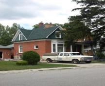 Of note is the unique cross-gabled roof.; Kayla Jonas, 2008.