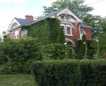 Of note are the steeply pitched multiple rooflines.; Kayla Jonas, 2008.