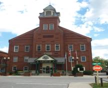 Featured is the red brick façade, including the central projection and tower.; Kayla Jonas, 2008.