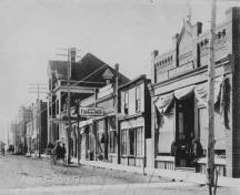 Archival view, from the northeast, of the Royal Canadian Legion (smaller building at left between two taller buildings), Carberry, ca. 1920; Carberry Plains Archives, ca. 1920