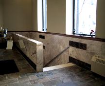 View of the Imperial Bank of Canada Building interior looking at the main stair, clad in marble, connecting the main floor with the basement (January 2005).; City of Edmonton, 2005