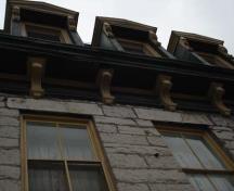 Of note are the two over two windows, wooden cornice, brackets, and dormer windows.; Martina Braunstein, 2007.