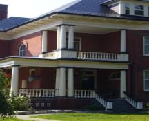 Of note is the second storey balcony and veranda supported by ionic style columns.; Kirsten Pries, 2008.