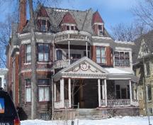 Of note are the multiple materials, turret form of the facade and slate roof.; Paul Dubniak, 2008.