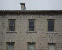 Of note are the segmented flat window arches and stone lintels of the upper storey windows.; Martina Braunstein, 2007.