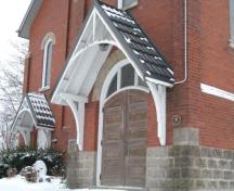 Featured is the semi-circular double door entrance.; Marth Fallis, 2008.