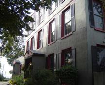 Of note are the symmetrical windows and central entranceway.; Kayla Jonas, 2007.