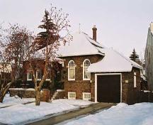 This view of the Trudel Residence illustrates the south-facing front with garage that overlooks the North Saskatchewan River valley. (2004); City of Edmonton, 2004