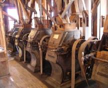 Interior view of the Esterhazy Flour Mill National Historic Site of Canada, showing five pairs of grinding roller units, 2007.; Agence Parcs Canada / Parks Canada Agency, A. Roos, 2007.