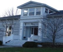 Of note is the Greek Revival portico and pediment window.; Kayla Jonas, 2008.