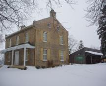Of note is the simple veranda with four columns.; Martha Fallis, 2008.