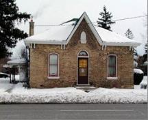 Of note are the medium hip roof with centre gable and the pointed arch attic window.; City of Brantford, n.d.
