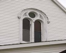 The double Roman window with oculus on the front façade; Bernard LeBlanc