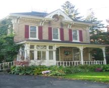 Of note is the widow's walk with iron cresting on the hip roof.; Martha Fallis, 2008.