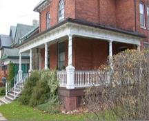 Featured is the large open porch extending to the north side of the facade.; City of Brantford, 2009.