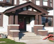 Featured is the portico with its gable roof, wooden brackets and square brick pillars.; City of Brantford, 2009.