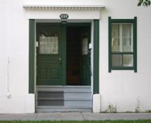 The double entranceway with lintel and Victorian glazed doors.; MCL, 2008