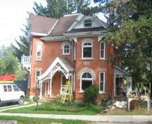 Of note are the original verandas on the facade and west elevation.; Martha Fallis, 2008.