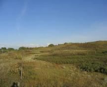 Looking east along the bottom of the Besant Valley from the west edge of the Protected Area, 2004.; Government of Saskatchewan, Marvin Thomas, 2004.