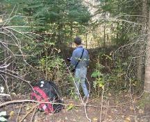 Standing on the near edge of the presumed cellar of the factor's house, 2004.; Government of Saskatchewan, Marvin Thomas, 2004.