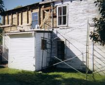 East wall being stripped of clapboard and sheathing in 1999. East, north and south walls have been reframed, resheathed and insulated. These three sides also have new windows, doors, clapboard and replicated eaves brackets.  Photo taken 1999.; Steve O'Driscoll 2010