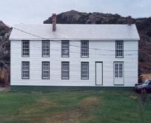 View of the front facade of Ashbourne Longhouse, Twillingate, NL.; HFNL 2010