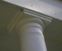 This photograph shows the top of a Doric column with a simple round capital and a square abacus, 2009; Town of St. Andrews