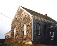 Side elevation, Old Guysborough Court House Museum showing porch and rear addition, Guysborough, 1989.; Heritage Division, NS Dept. Tourism, Culture and Heritage, 1989