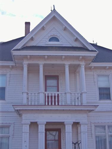 Detail of pedimented dormer over balcony