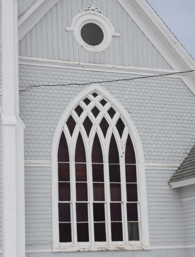 Detail of Gothic window and exterior cladding